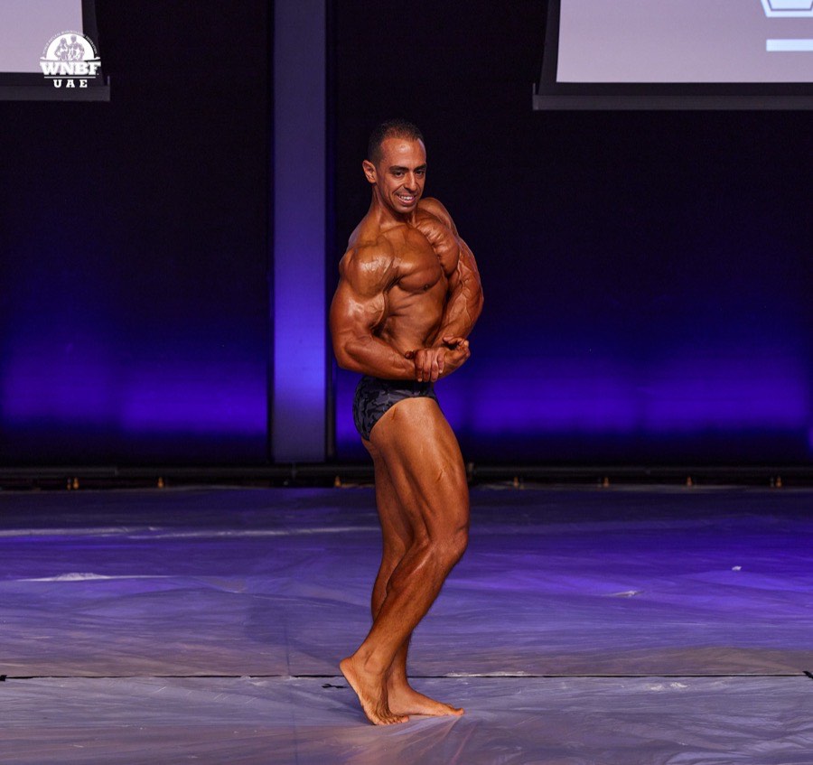 Client on stage at WNBF UAE natural bodybuilding competition